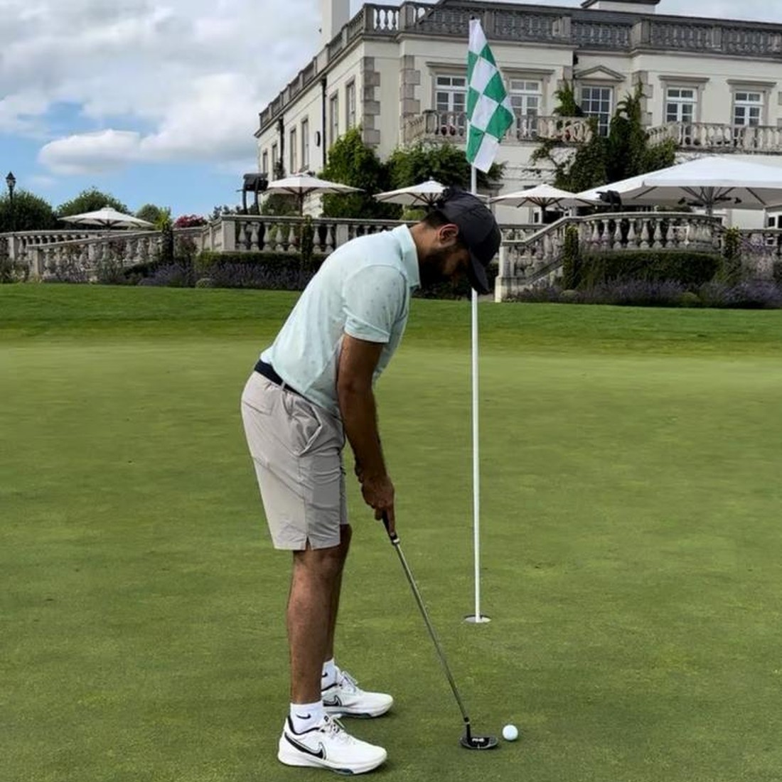 Jin playing golf